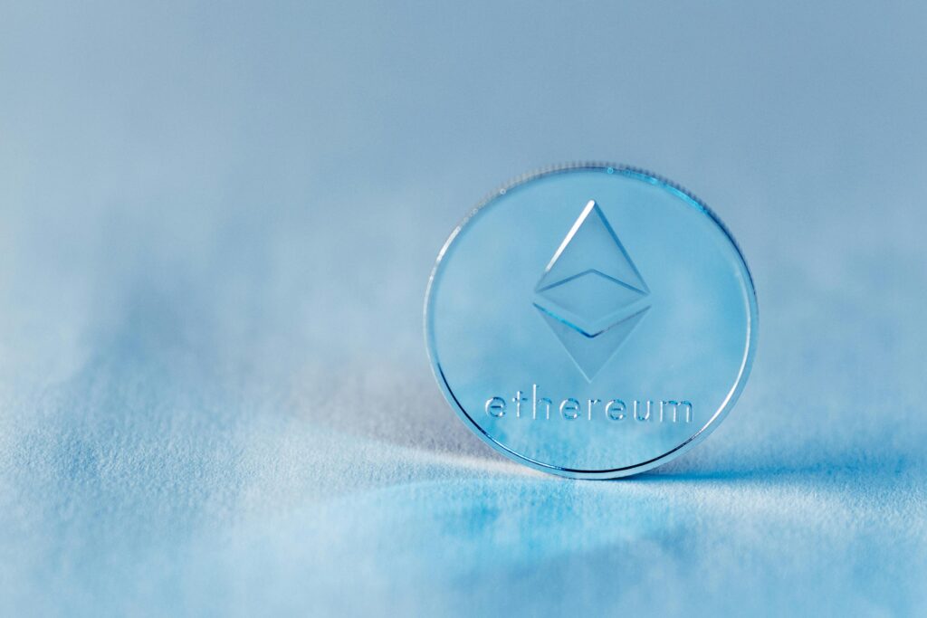 Close-up of a transparent Ethereum coin symbolizing blockchain technology and modern finance.