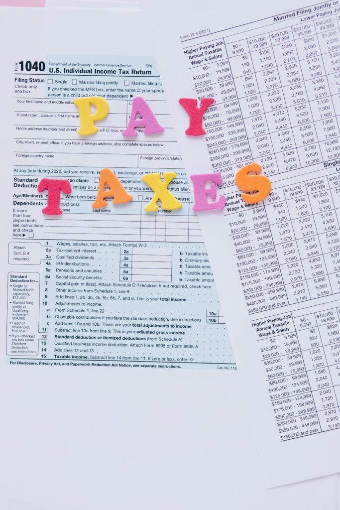 California Mileage Tax Colorful letters on tax forms, ideal for finance and tax-related themes.