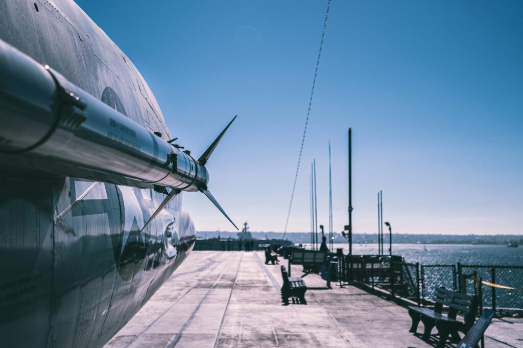 Ballistic Missiles of the United States Aerial view of missile-equipped military aircraft on naval ship deck in San Diego harbor.