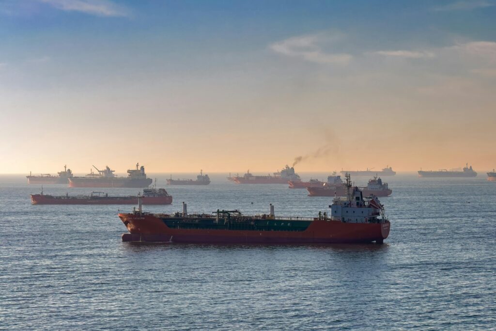 Cargo ships and oil tankers on the Bosporus strait, capturing global trade and maritime logistics at sunset.