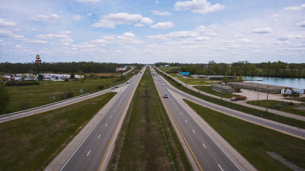 Scenic aerial view of an open highway in Shelbyville, Indiana on a cloudy day.