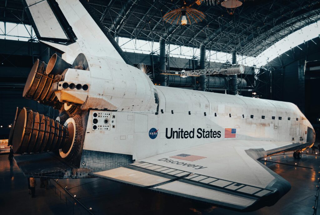The Space Shuttle Discovery on display at the Udvar-Hazy Center, showcasing American space exploration milestones.